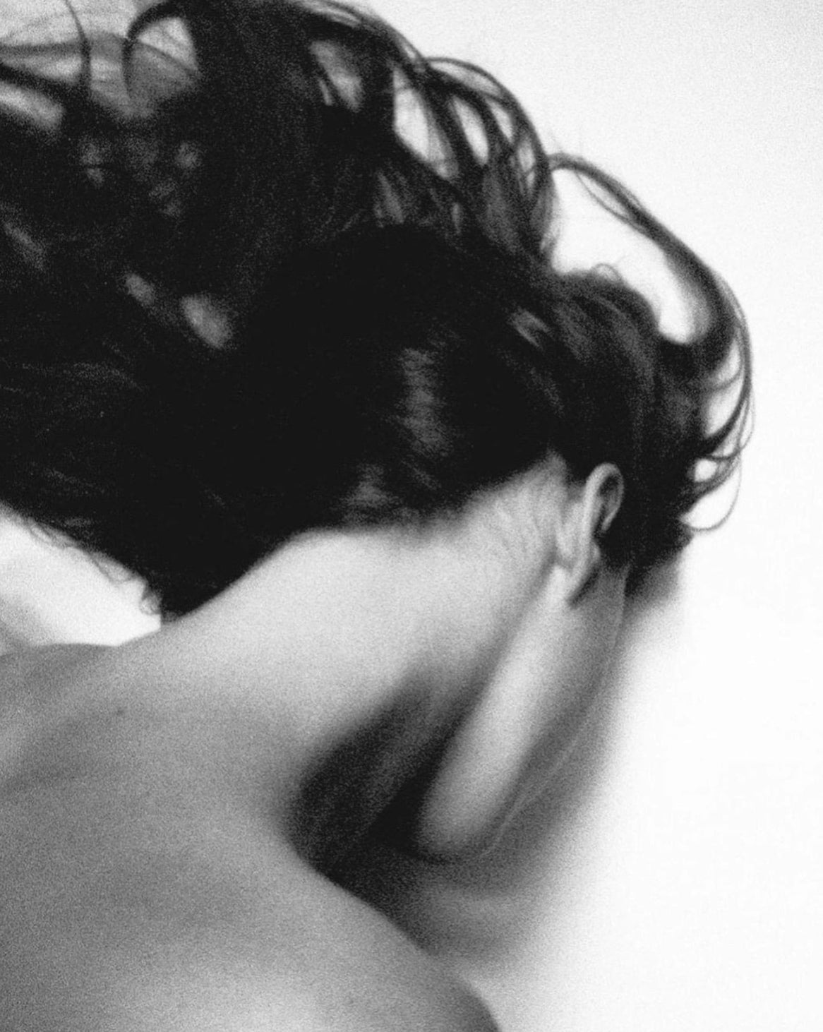 a woman from behind showing her neck and hair