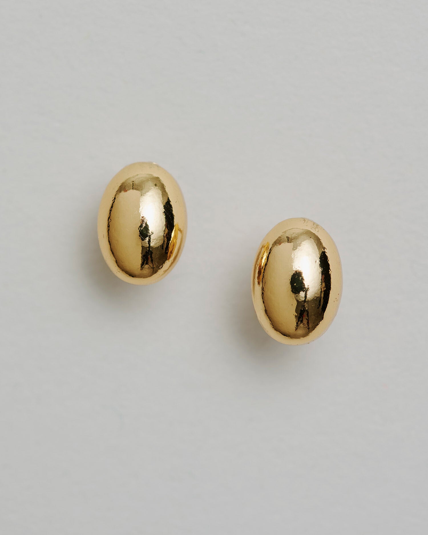 The Lexie Pebble Gold-Plated Earrings – minimalist round gold studs with organic shape by SELF Seductions