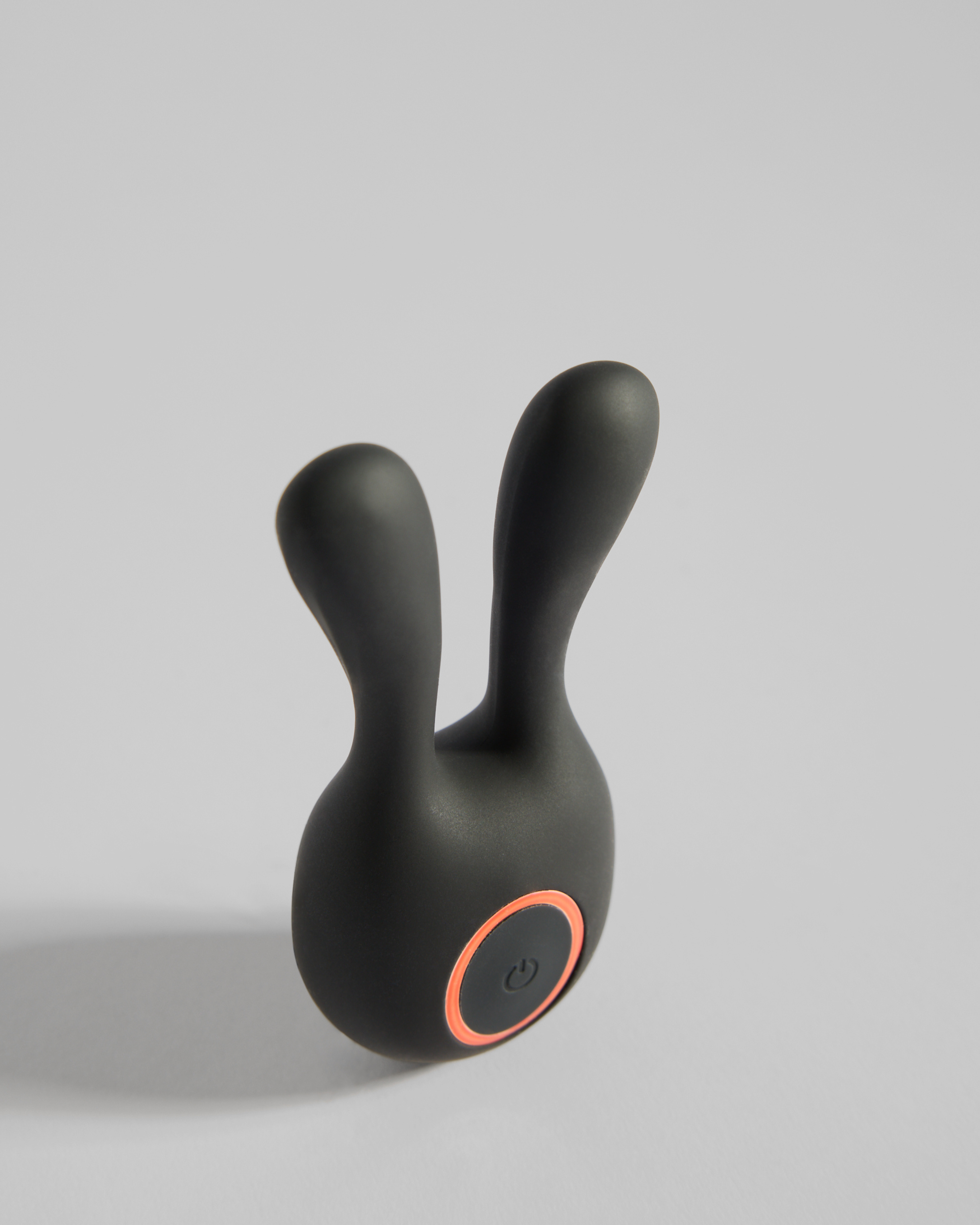 Black twin-ear silicone massager shown at an angle – elegant SELF Seductions design for sensual wellness