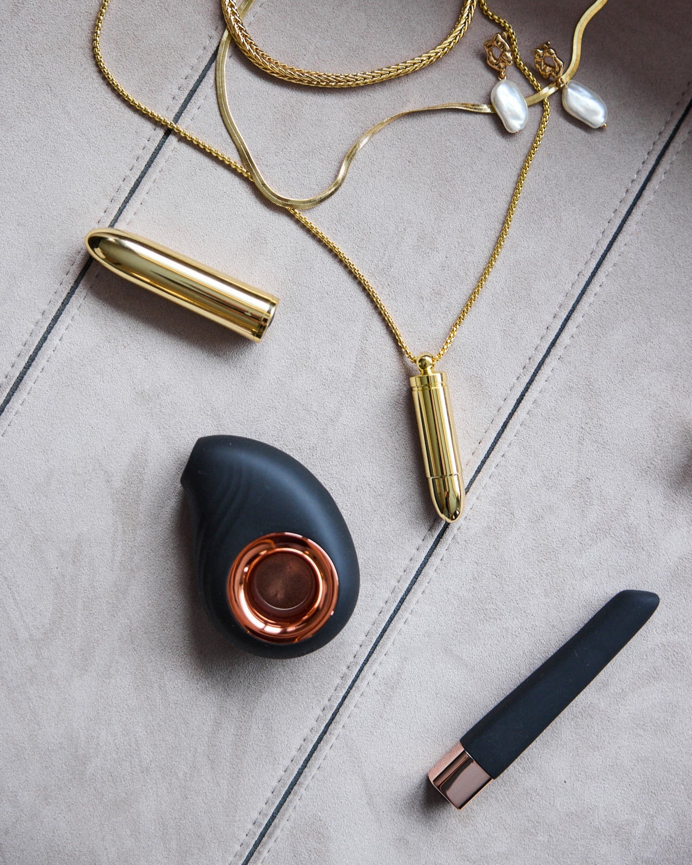 Leonora Air Wave Massager styled with SELF Seductions accessories in gold tones – modern wellness aesthetic