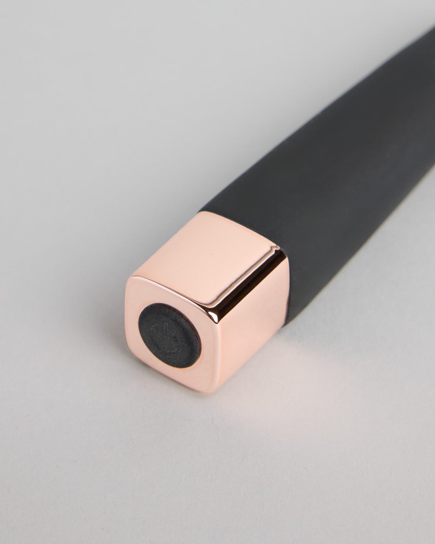 Detail view of Serena Spellbound wellness device showing rose-gold accent and smooth silicone design
