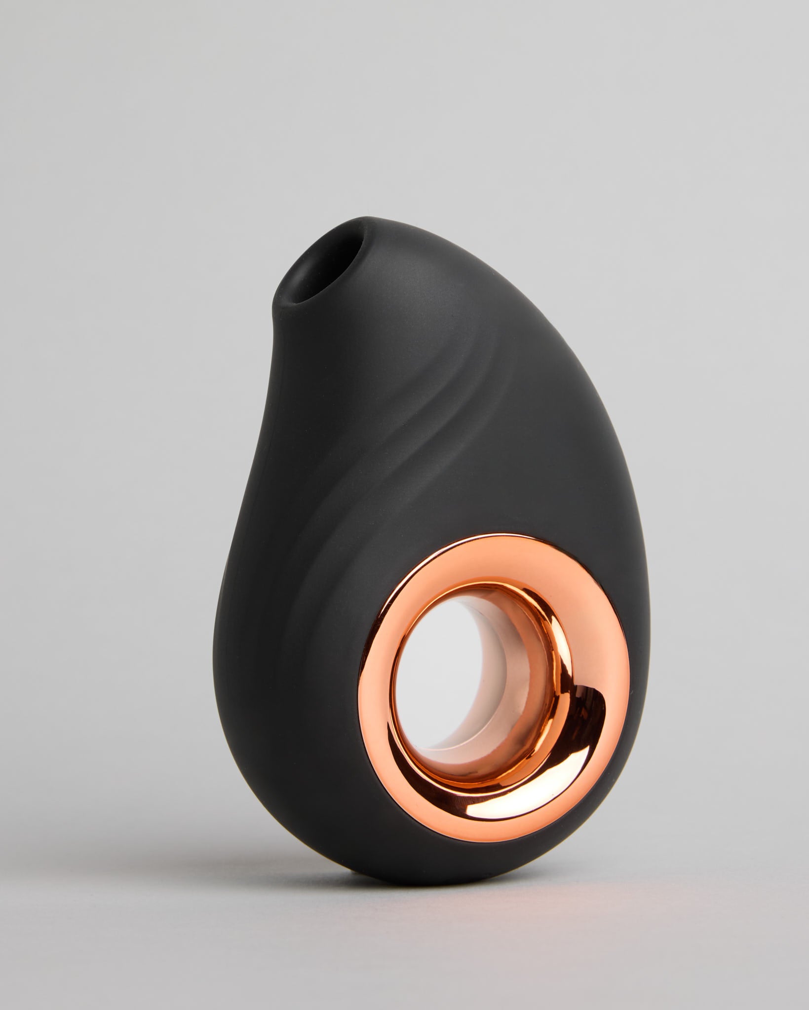 Side view of the Leonora Air Wave Massager showing sleek black shape and refined finish