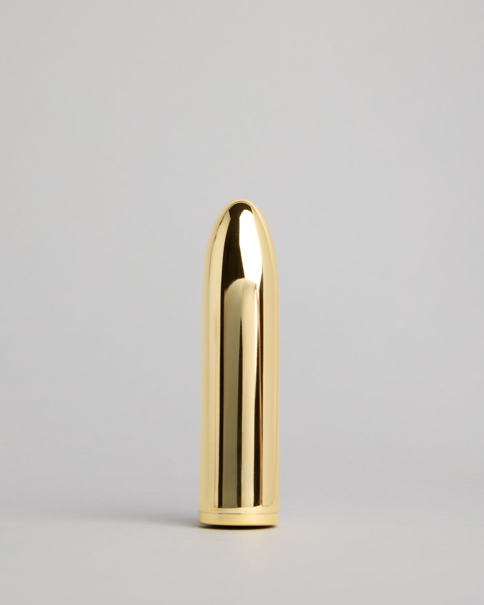 Front view of the gold Belle Mini Massager – elegant compact design for modern wellness
