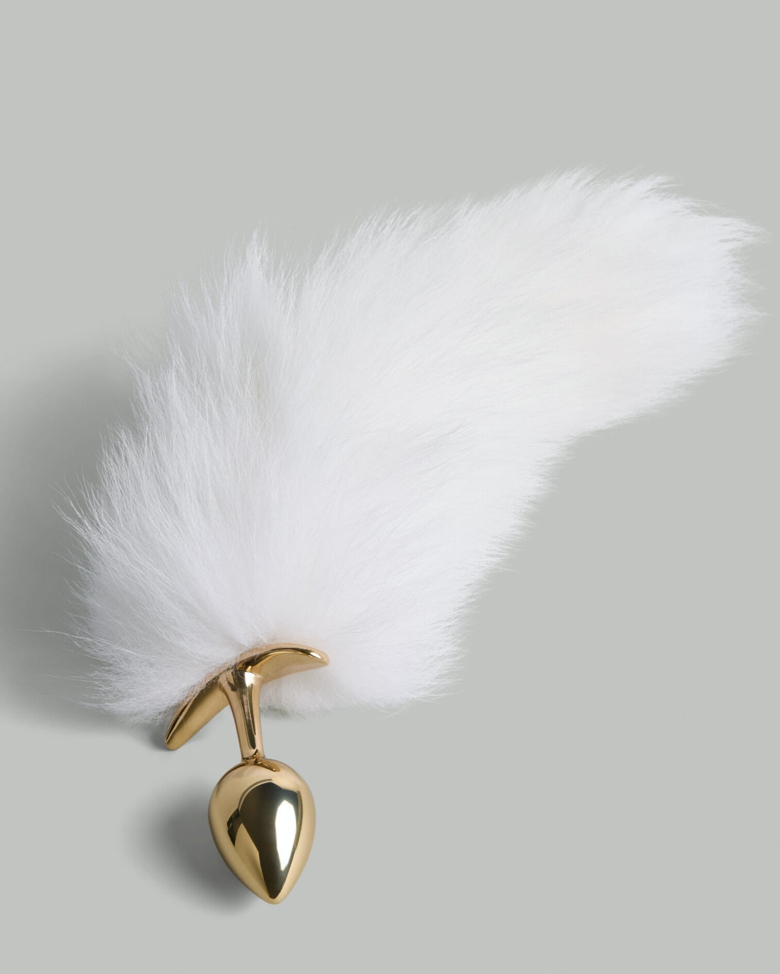 Elegant gold wellness accessory with soft white faux-fur accent by SELF Seductions