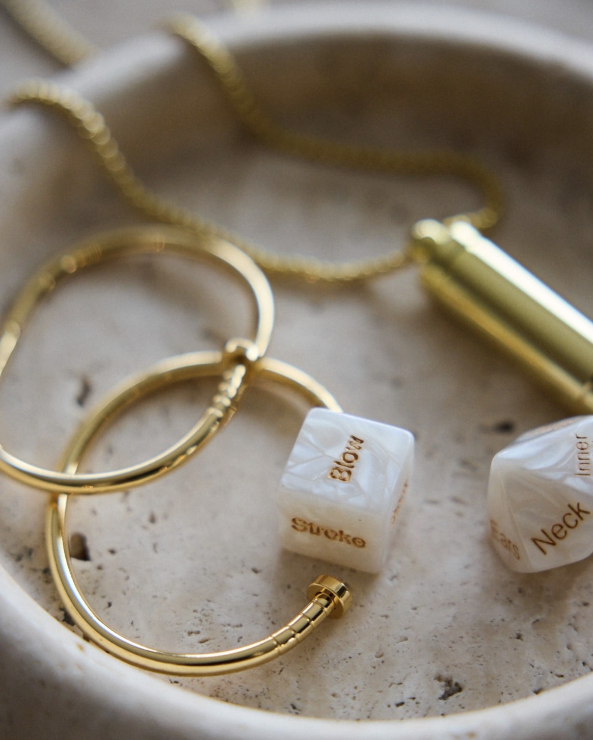 SELF Seductions sensual dice styled with gold jewellery – refined and intimate aesthetic