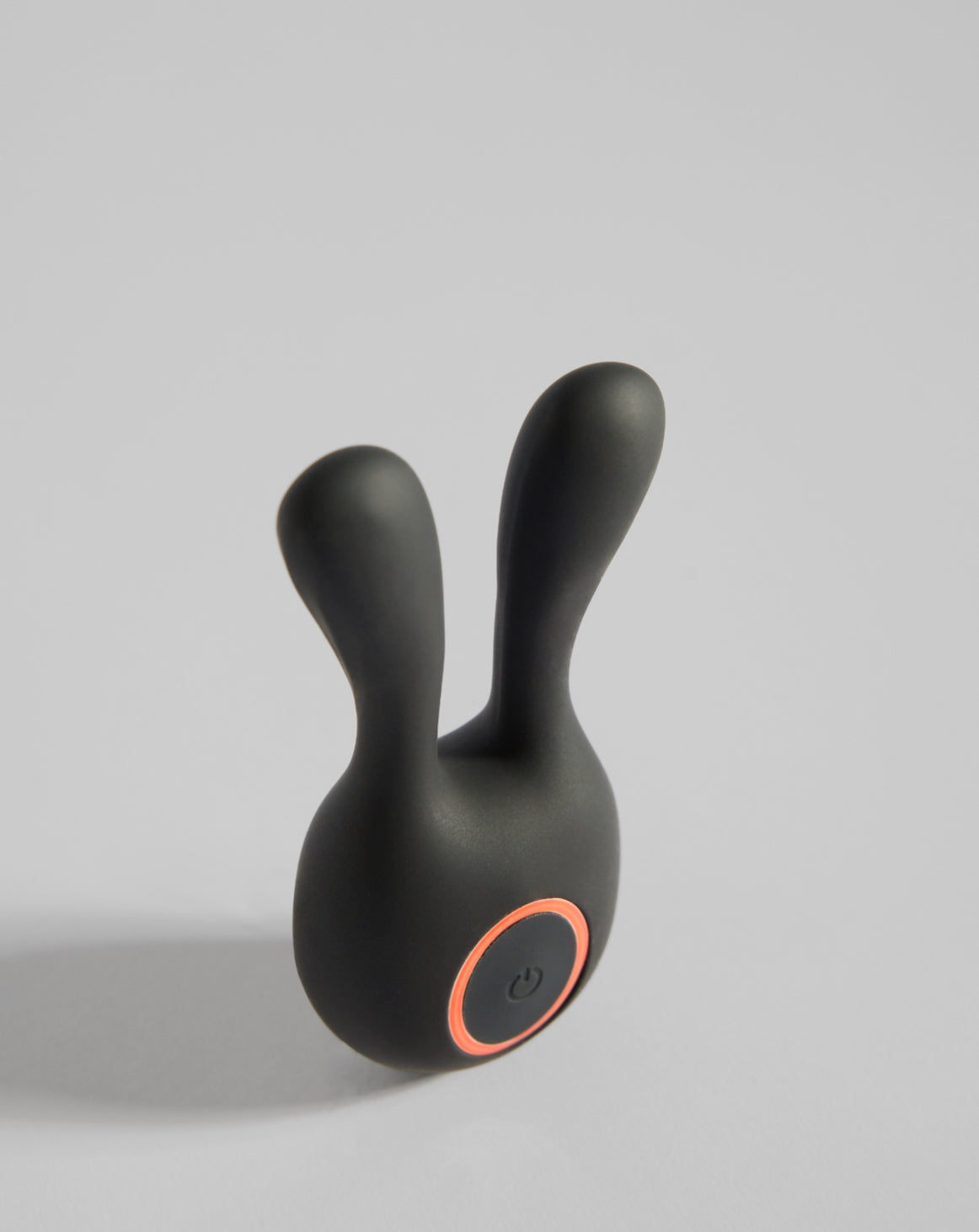 Black twin-ear silicone massager shown at an angle – elegant SELF Seductions design for sensual wellness