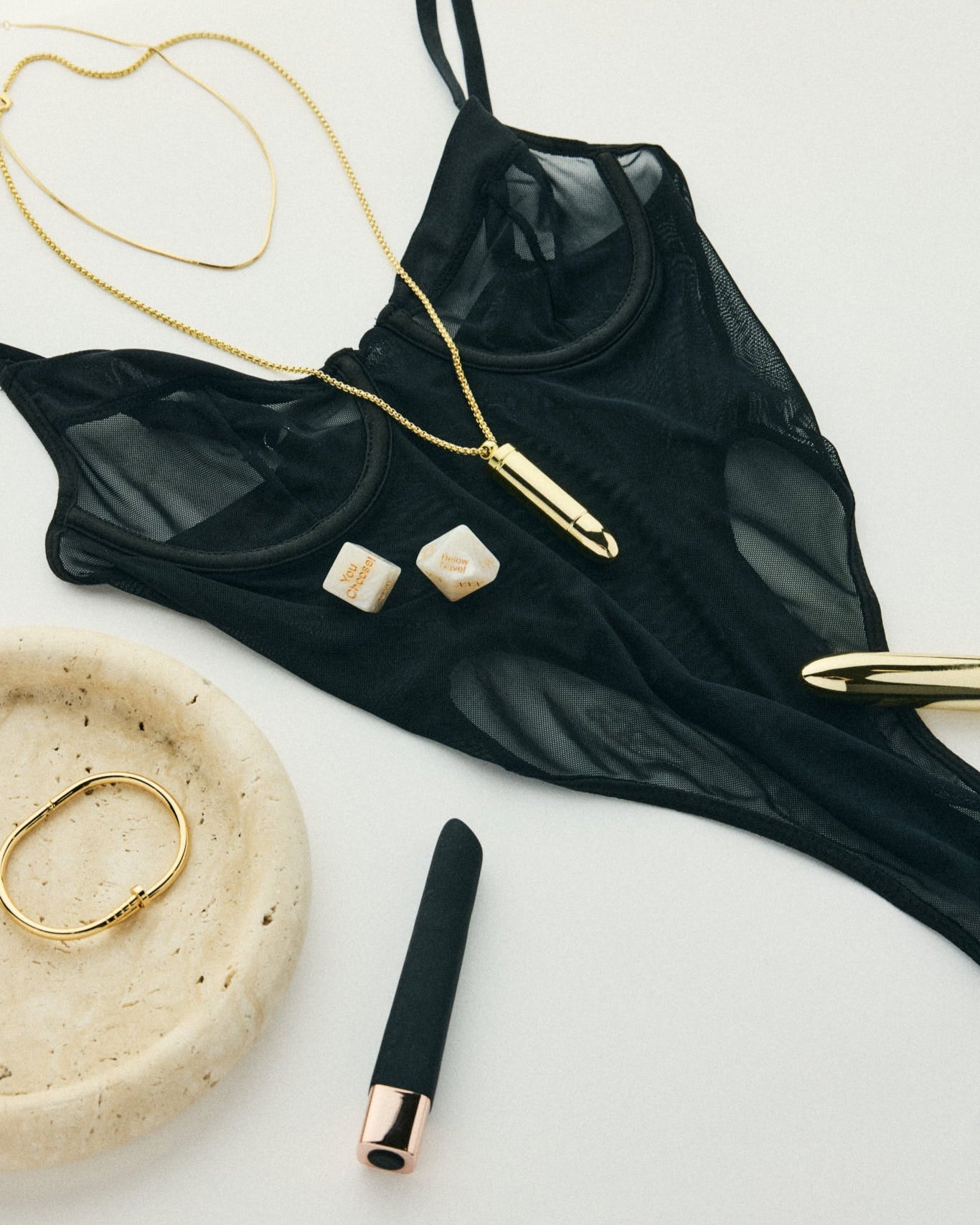 Lucille black mesh bodysuit styled with gold jewellery and wellness pieces – refined SELF Seductions aesthetic