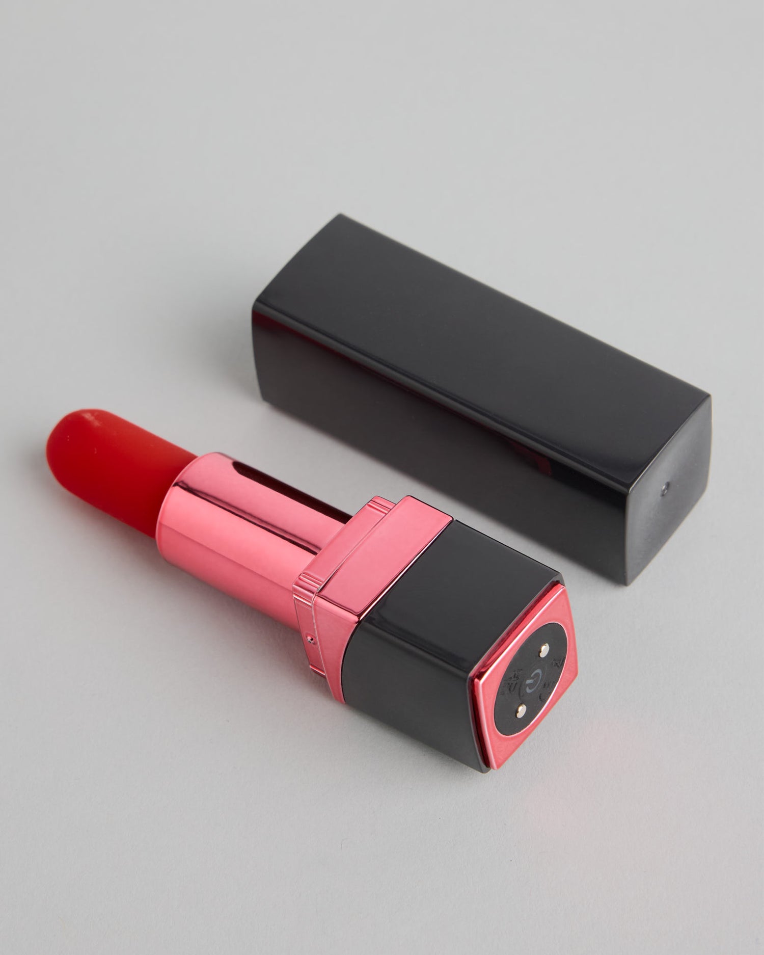 Detail view of The Liz Undercover Lipstick Accessory showing compact design and soft silicone tip