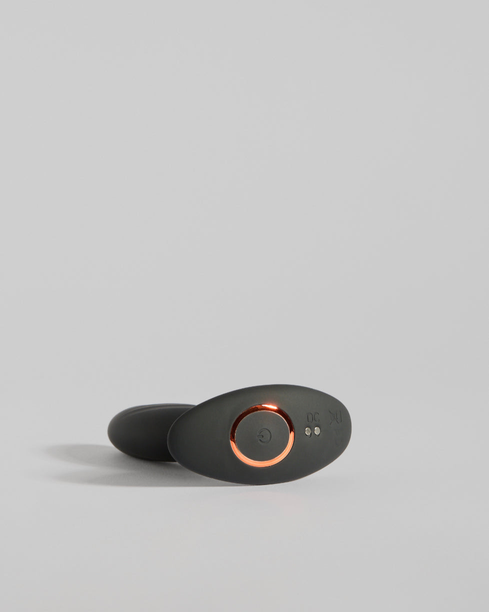 Sculptural black wellness design with smooth contours and modern matte finish by SELF Seductions laying down