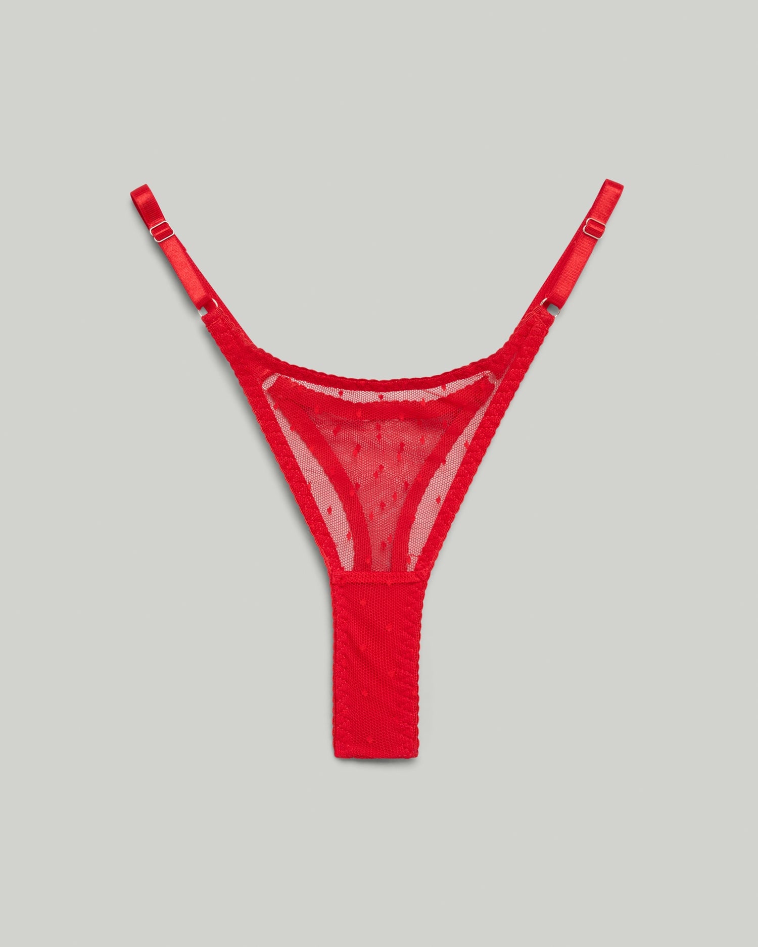 Red sheer mesh thong with subtle dot texture, designed for a minimal and sensual fit, part of the Bianca lingerie set by SELF Seductions.