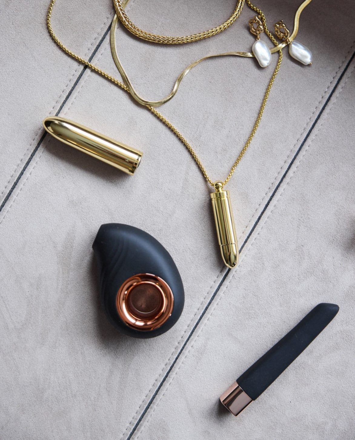 Leonora Air Wave Massager styled with SELF Seductions accessories in gold tones – modern wellness aesthetic