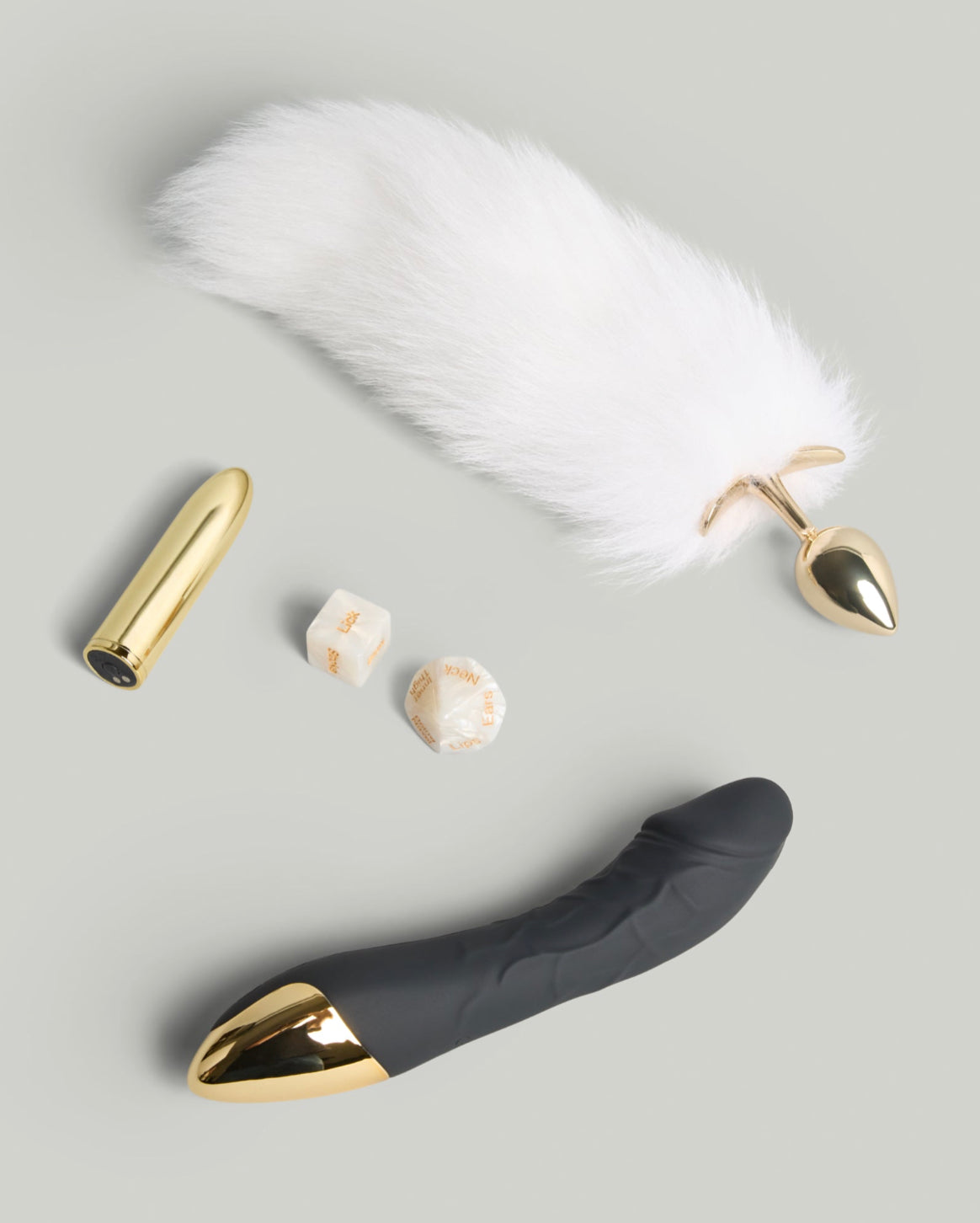 The SELF Inner Harmony Wellness Trio featuring a gold bullet vibrator, curved black massager and feather accessory styled in a clean flat lay.