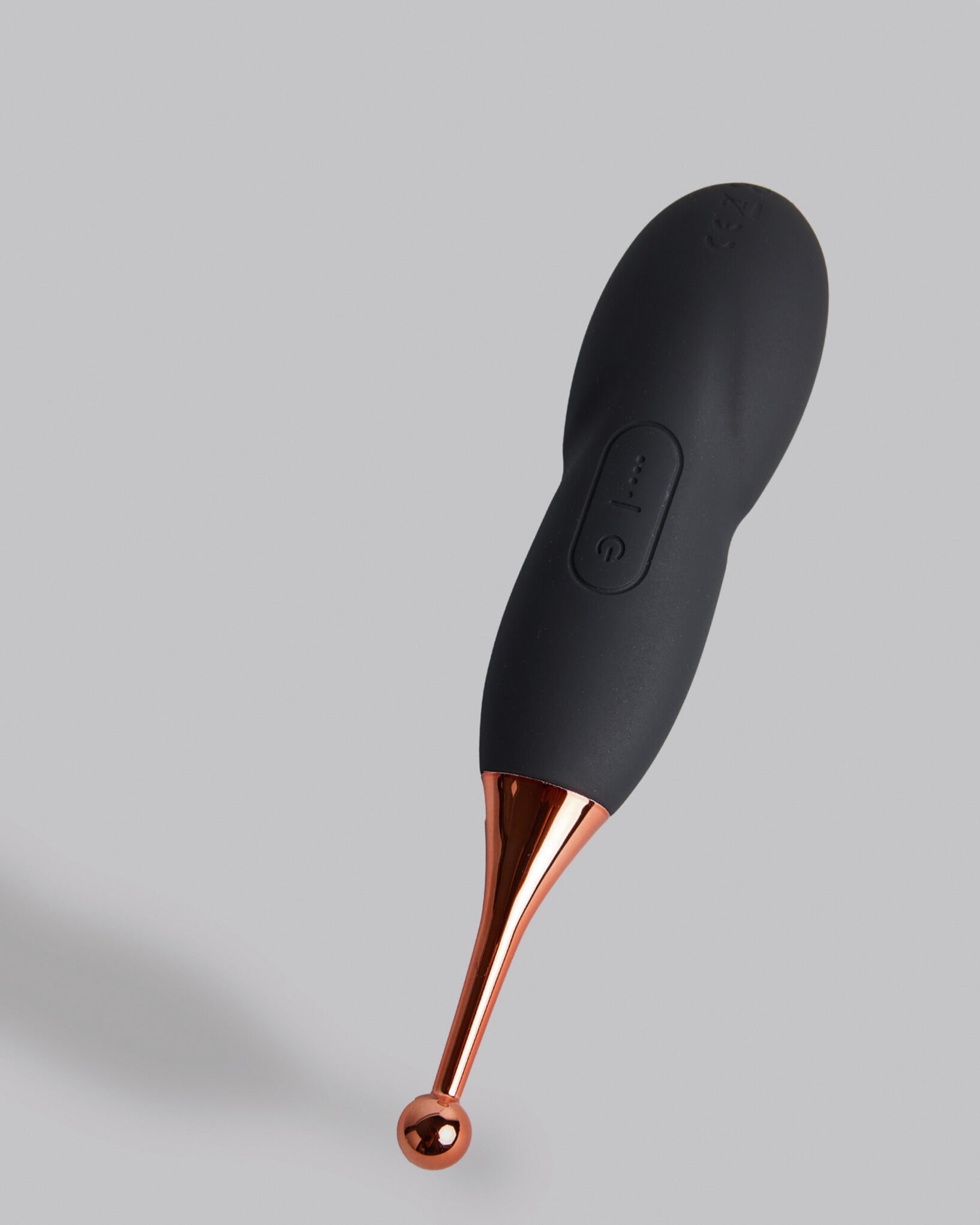 Sleek black touch-free wellness massager designed for balance and relaxation